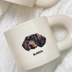 Close-up of a custom pet portrait mug with a dachshund dog illustration and the name ‘Bubble’ on the front.