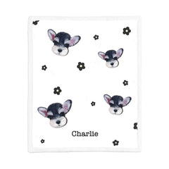 A minimalist MusaMonster custom pet blanket featuring pet portraits, names, and a white background with black flower accents.